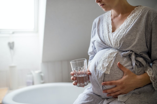 Pregnant Woman with drinking water - Everpure Water Filtration