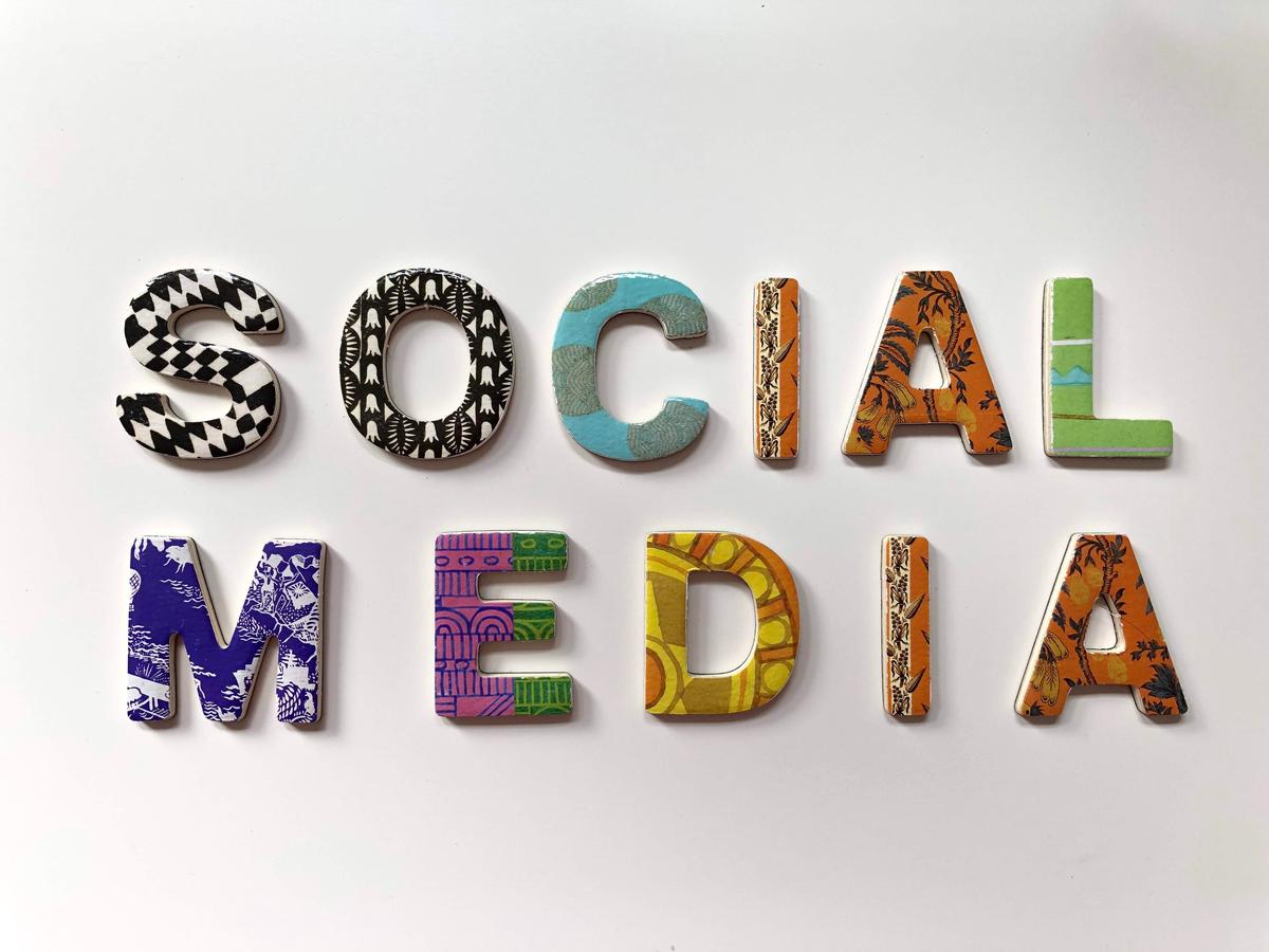 An image of business people using social media on their devices